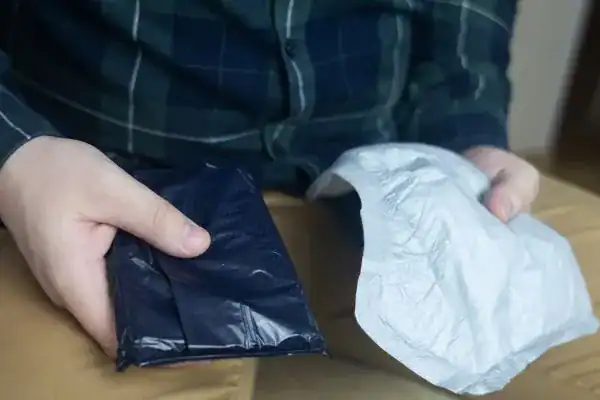 image of man holding stool incontinence Luton products